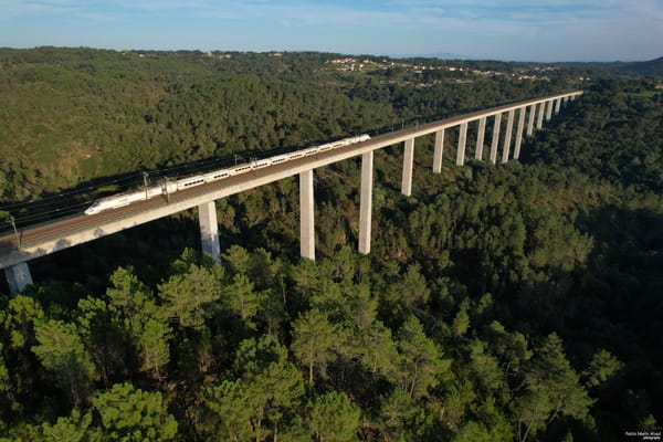 A Talgo train on a bridge