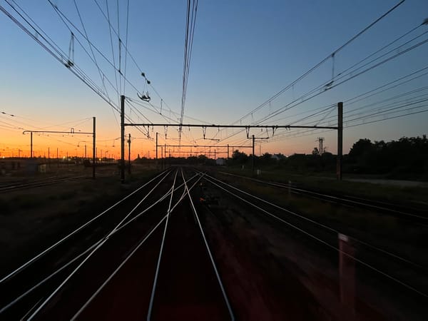 Sun setting over the electrification wires south of Paris Austerlitz